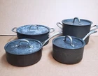 8 Piece Calphalon Anodized Aluminum Cookware Set - Sauce & Stock Pots + Lids Used. Price: $105.00.