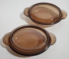2 Corning Vision Amber Oval Casserole Dish V-14-B & Pyrex Lid P-14-C Casserette Used. Price: $24.00.