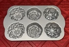 Pioneer Woman Nonstick Heavyweight Cast Aluminum Floral Cakelet Pan New. Price: $25.00.