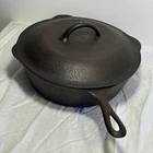 1 Notch Lodge #8 Hammered Cast Iron Deep Skillet And Lid Used. Price: $195.00.