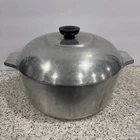 Magnalite Wagner Ware 4248P Dutch Oven Stock Pot And Trivet Used. Price: $59.99.