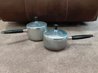 Wear Ever R-780 1/2 And R-781 Aluminum Plus Stainless Inner Clad Pan Pot W/ Lids Used. Price: $44.00.
