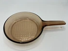 Pyrex Corning Amber Vision Ware 7" Waffle Bottom Frying Pan Used. Price: $11.04.