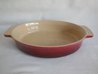 Creuset Cerise Red Oval Stoneware Casserole & Baking Dish Never Used. Price: $40.00.