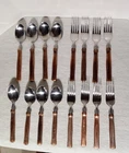Gibson Stainless Flatware Set With Copper Tone Handle 18/0 China 29 Used. Price: $20.00.