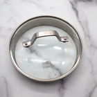 Calphalon Strainer Glass Stainless Steel Replacement Lid Only 7" Od 6 3/8" Used. Price: $12.50.