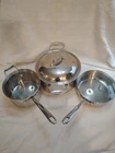 Emeril Lagasse 6 Piece Stainless Steel Cookware Set. Glass Lids Lot Used. Price: $60.00.