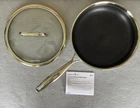 Pampered Chef New 10" Stainless Steel Hex Nonstick Skillet With Glass Lid. Price: $125.00.
