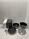Staub Enameled Cast Iron Stackable Cookware 4PC Set Graphite Grey New. Price: $359.99.