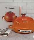 Creuset Enameled Cast Iron Signature Round Bread Oven, 9.5 Inch, Flame New. Price: $180.00.