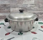 Vintage Wear Ever 1294 Aluminum 5-QT Stock Pot Dutch Oven & Lid Bakelite Handles Used. Price: $25.00.