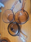 4 Piece Vintage Corning Visions Sucepan Set Pyrex Amber 3 1 Lid Used. Price: $40.00.