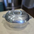 Vintage Wagner Ware Magnalite Oval Roaster Dutch Oven With Lid & Trivet 4265P Used. Price: $160.00.
