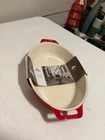 Staub Ceramic Oval Roasting Dish 11X8 Cherry Red Baking New With Sleeve. Price: $25.00.