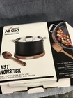 6 Qt All-clad Cast Iron Enameled Dutch Oven With Acacia Wood Trivet Used. Price: $99.99.
