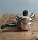 Saladmaster 316TI Titanium Quart Saucepan W/ Steamer Basket, Lid, & Handle Used. Price: $349.50.