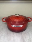 Creuset 5.5 Qt. Enameled Cast Iron Signature Round Dutch Oven, Cerise -read- New. Price: $295.00.