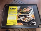 Lodge Seasoned Cast Iron Double Sided Grill/griddle New. Price: $25.00.