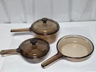 Pyrex Vision Corning Ware Amber Glass 5PC. Set .5L W/lid 1.OL W/lip & 7" Waffle Used. Price: $44.00.